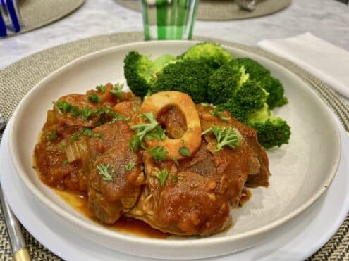 A plate of veal with broccoli