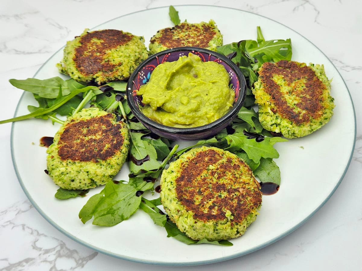 plate of broccoli fritters on a bed of salad