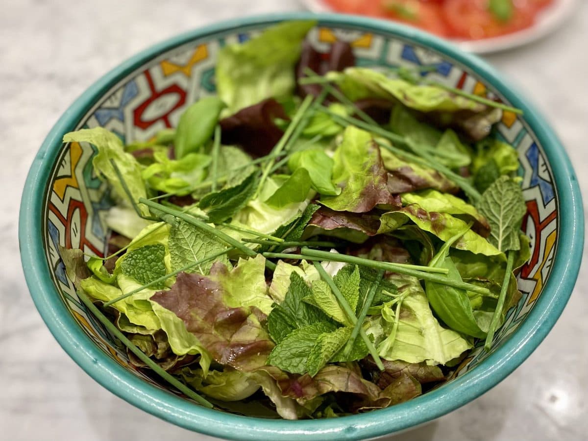 A bowl of mixed leaves and herbs
