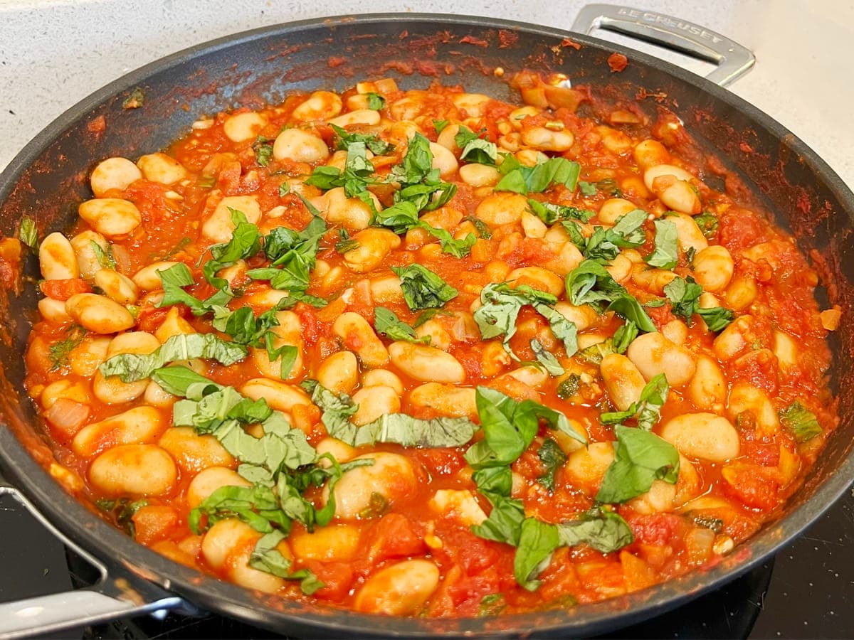 saucepan with butter beans and tomato stew